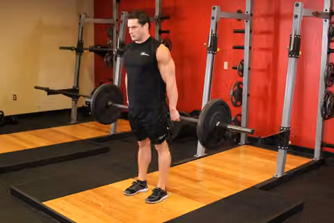 Demonstrasi gerakan Barbell Hack Squat.